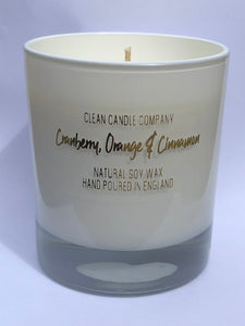 Cranberry, orange and cinnamon soy wax candle in white glass jar